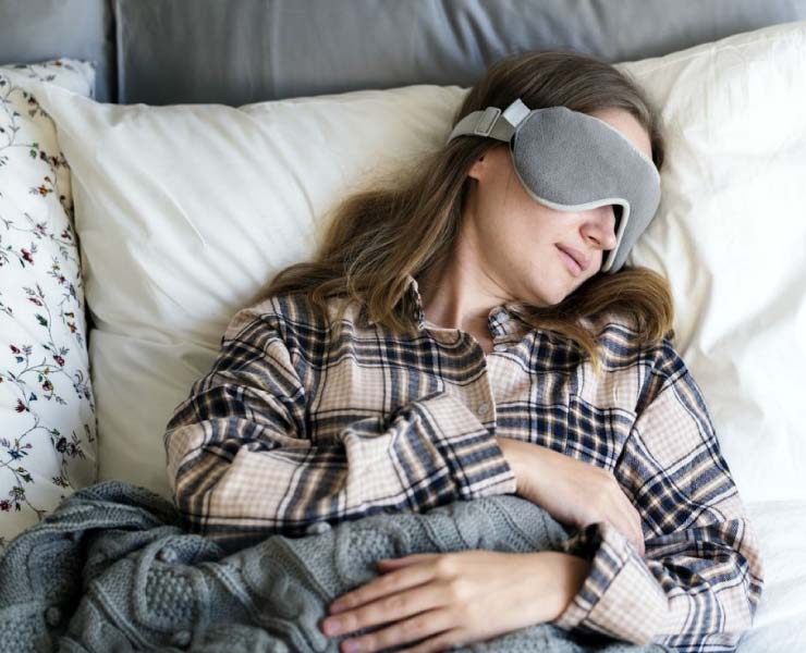 Woman sleeping with eye mask