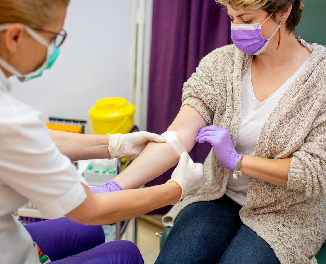 Women getting blood drawn