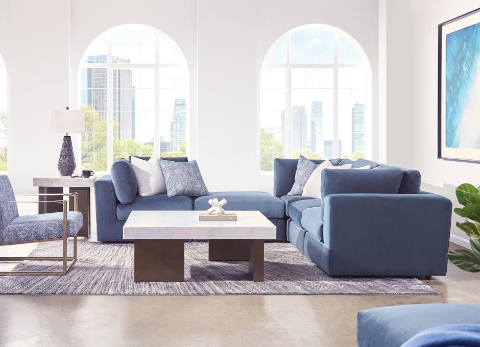 Blue couch and chair with small coffee table
